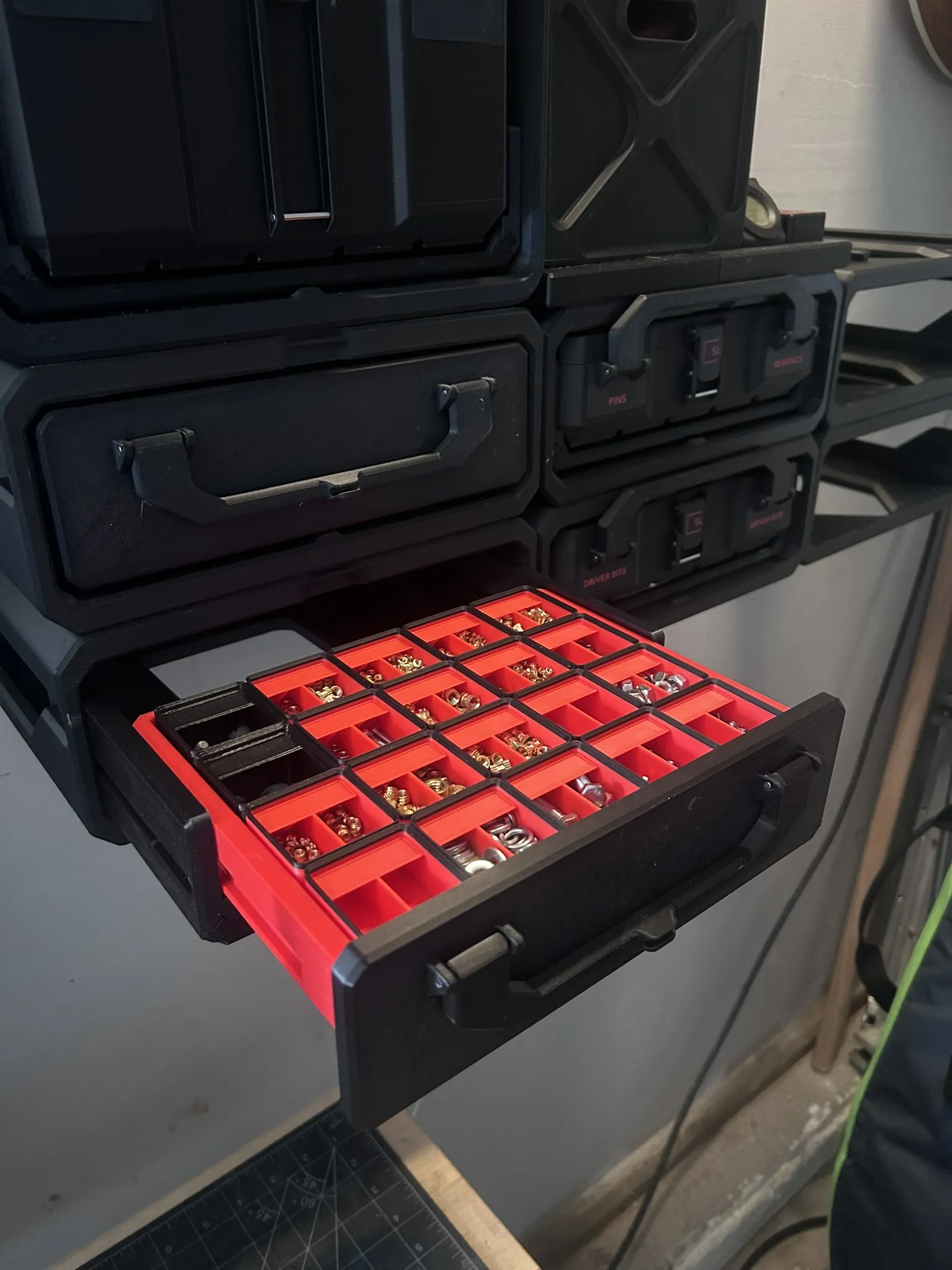 Finished Graphite Modular storage box with insert layout installed on a workshop bench